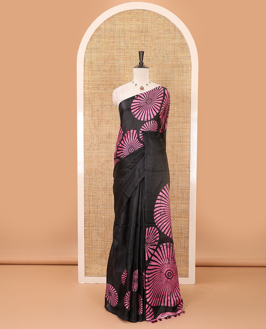 Black-base plain body khadi cotton saree with batik-style pink-color radiant sunburst design on its border & pallu, plain black blouse
