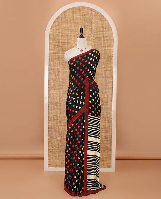 Black colorful polka dots printed satin crepe saree, contrast piping border, stripes printed pallu & contrast printed blouse