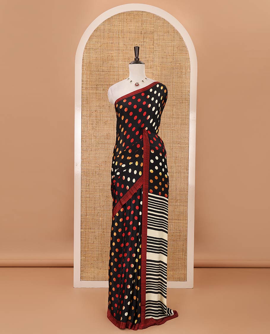 Black colorful polka dots printed satin crepe saree, contrast piping border, stripes printed pallu & contrast printed blouse