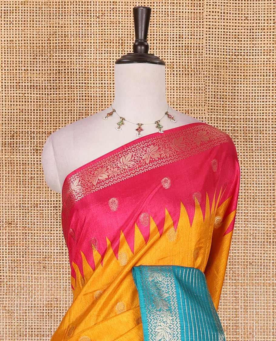 Yellow zari buttas dola silk saree, contrast pink-blue temple ganga jamuna traditional zari border, paisley pallu, and contrast zari design blouse