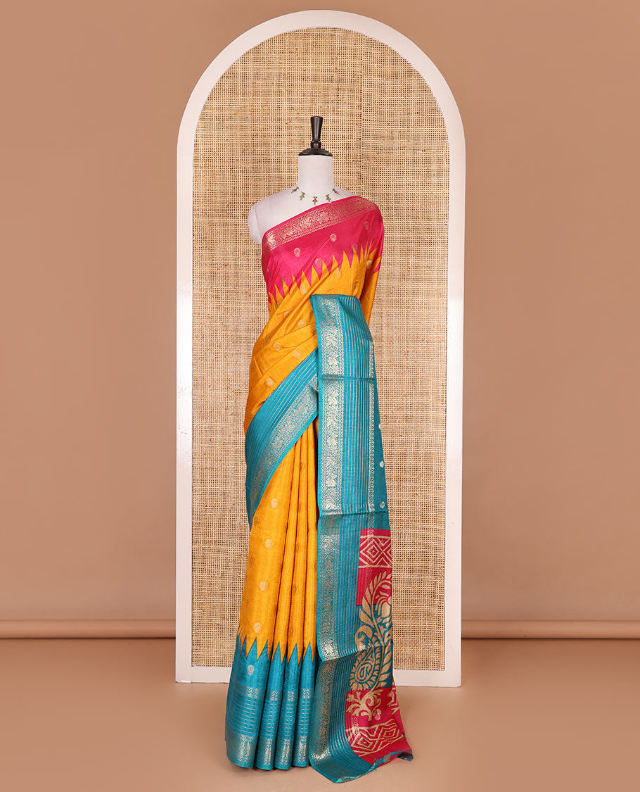 Yellow zari buttas dola silk saree, contrast pink-blue temple ganga jamuna traditional zari border, paisley pallu, and contrast zari design blouse
