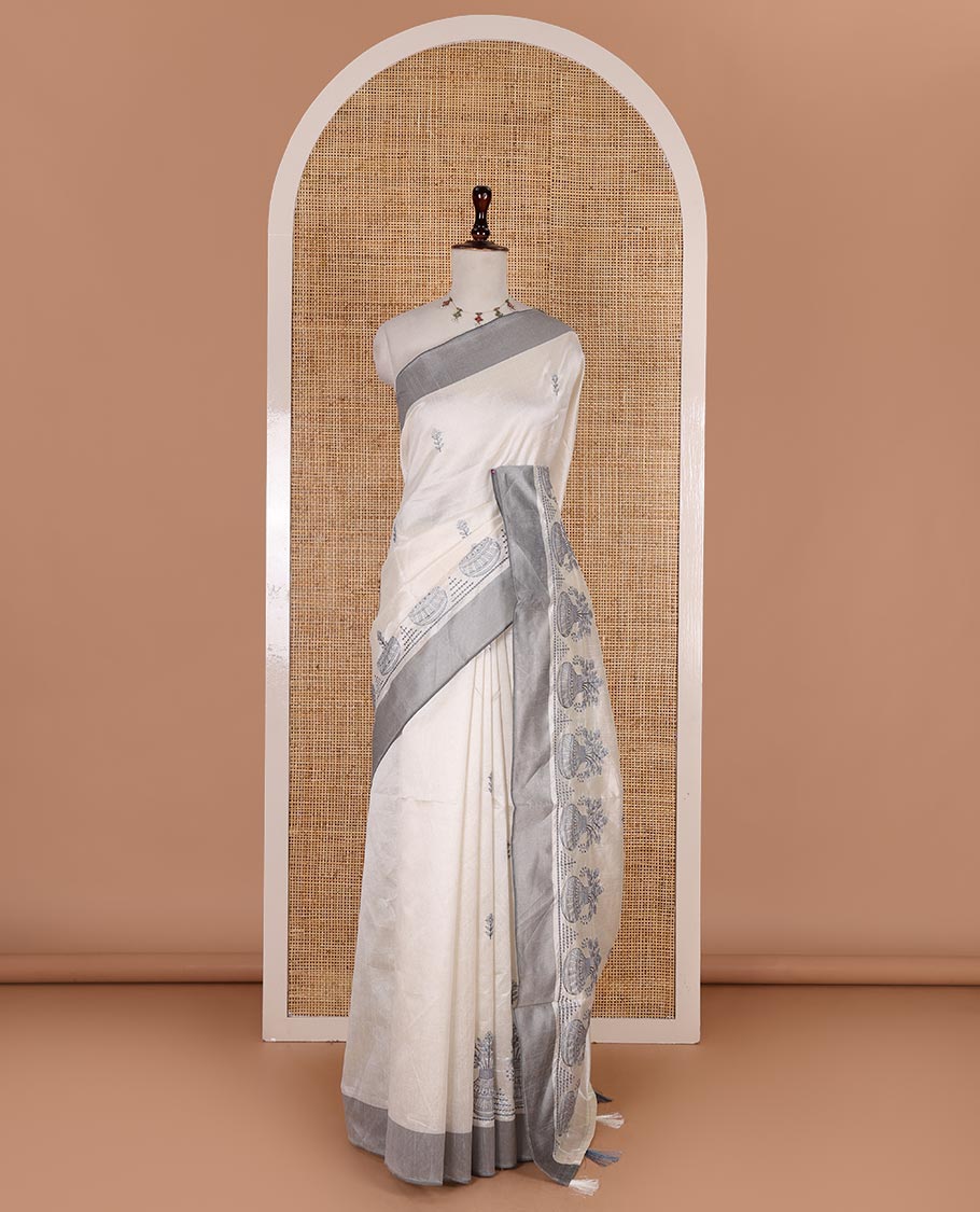 Half-white flower and flower pots motifs thread embroidered semi-tussar saree, contrast grey border, flower motif embroidered pallu, and a matching blouse