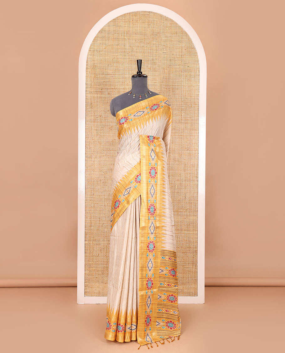 Chikku- yellow plain Katan silk saree, contrast ikkat floral-geometric printed temple border, ikkat printed pallu, and ikkat printed blouse
