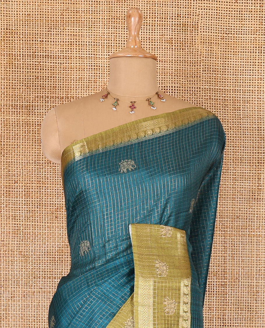 Peacock green zari checked and elephant buttas saree with contrast traditional zari border of elephant print, floral vine printed pallu, and a contrast floral vine printed blouse