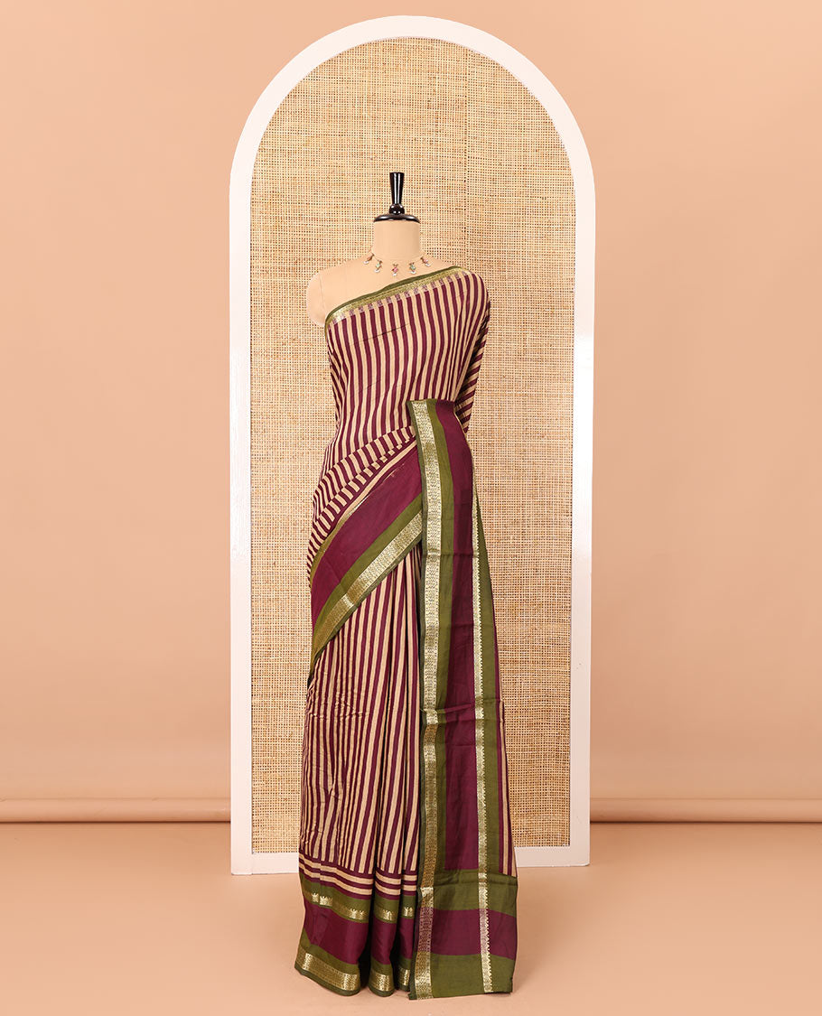 Wine vertically striped muslin silk saree, contrast zari rettai pettu border, kalamkari floral vine printed pallu, and a contrast plain blouse