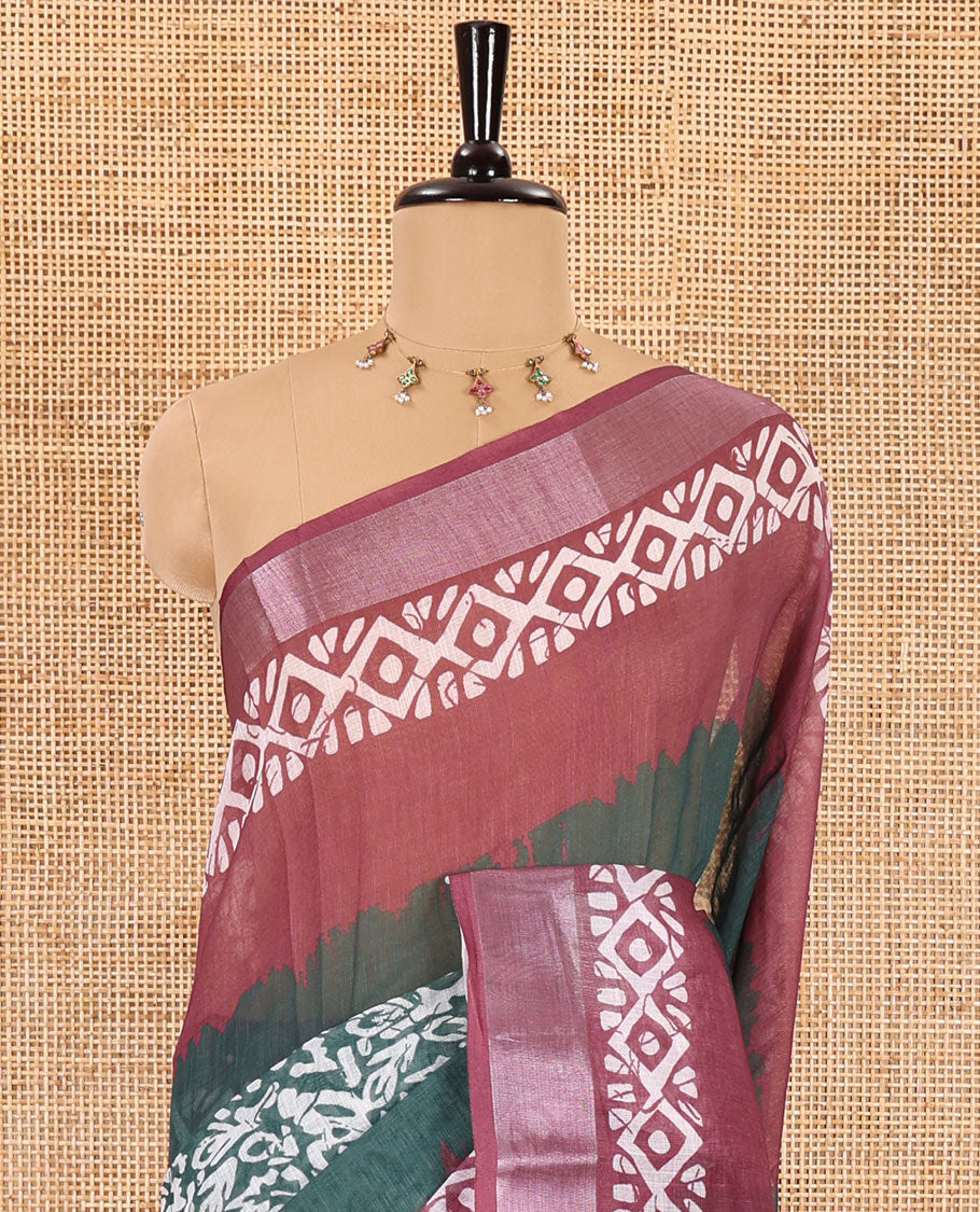 Green batik printed linen cotton saree, contrast printed and zari work border, batik printed pallu, and a contrast printed blouse