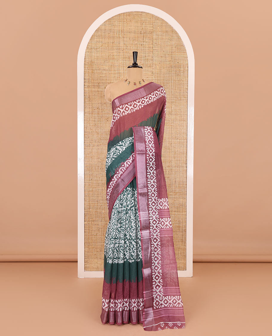 Green batik printed linen cotton saree, contrast printed and zari work border, batik printed pallu, and a contrast printed blouse