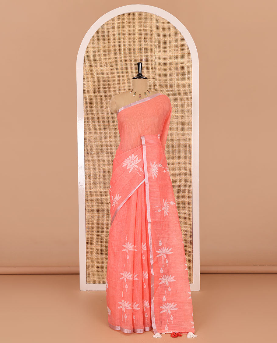 Orange Pichwai lotus printed linen cotton saree, piping zari border, colorful tasselled lotus printed pallu, and a contrast lotus printed blouse