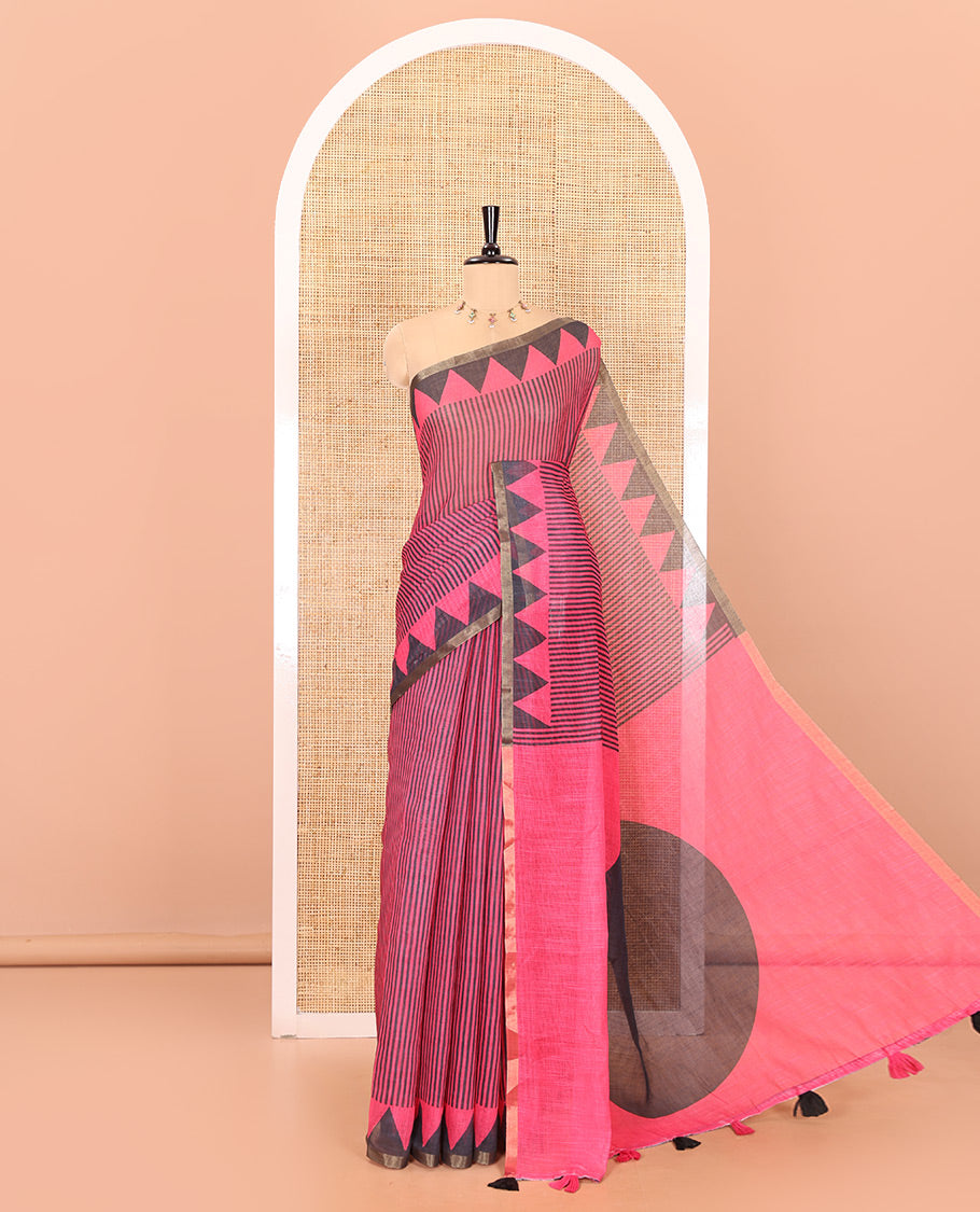 Pink vertical stripes printed linen cotton saree, a temple-printed border, big polka dot printed pallu, and a printed blouse