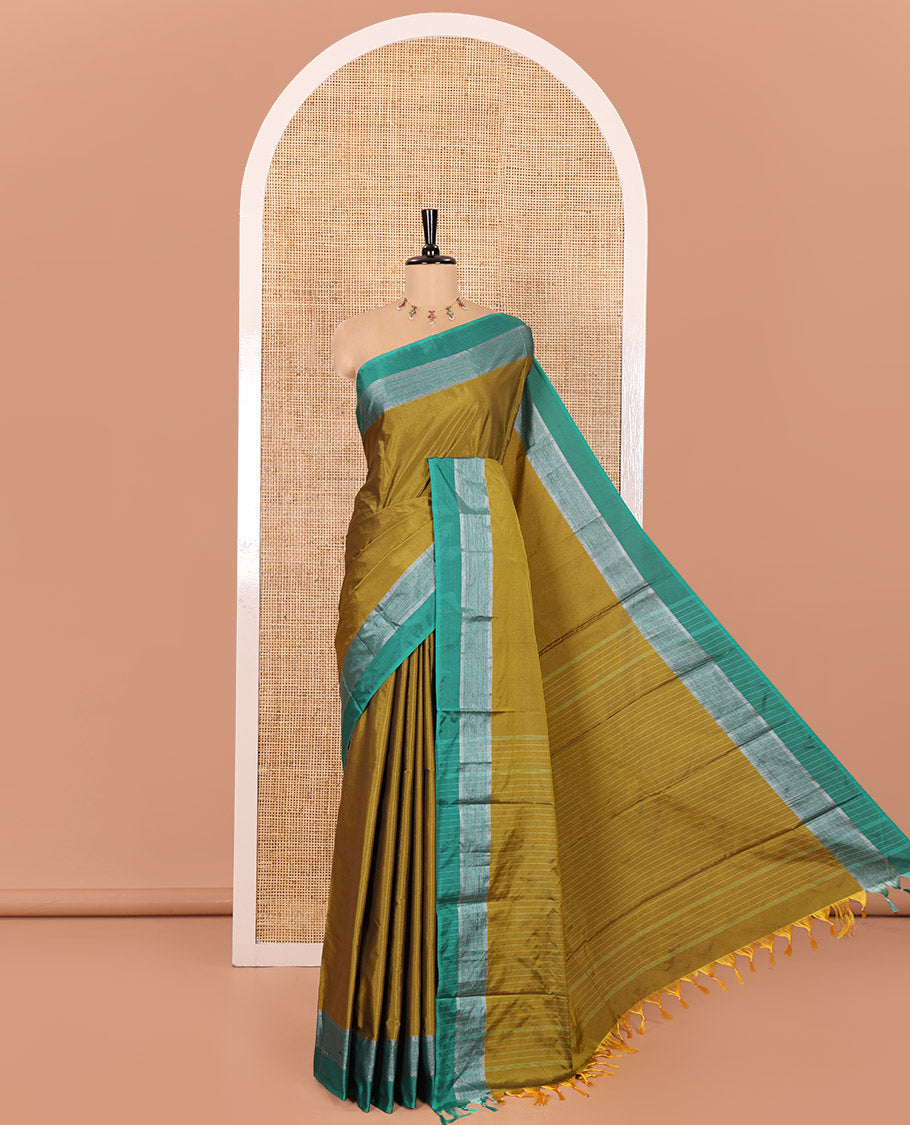 Mehenti Plain Semi-Soft Silk Saree, Complemented by a Contrast Silver Zari Striped Border, Sparsely Striped Pallu, and Paired with a Matching Blouse
