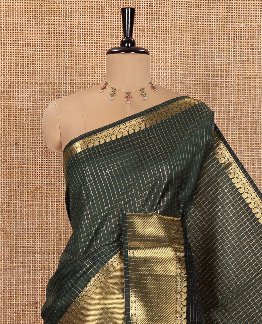 Green Semi-Katan Silk Saree, Ornamented with Golden Zari Checks on Its Body, Highlighted by a Traditional Zari Border of Paisley and Rudraksham Designs, Gleaming Pallu, and Paired with a Matching Blouse