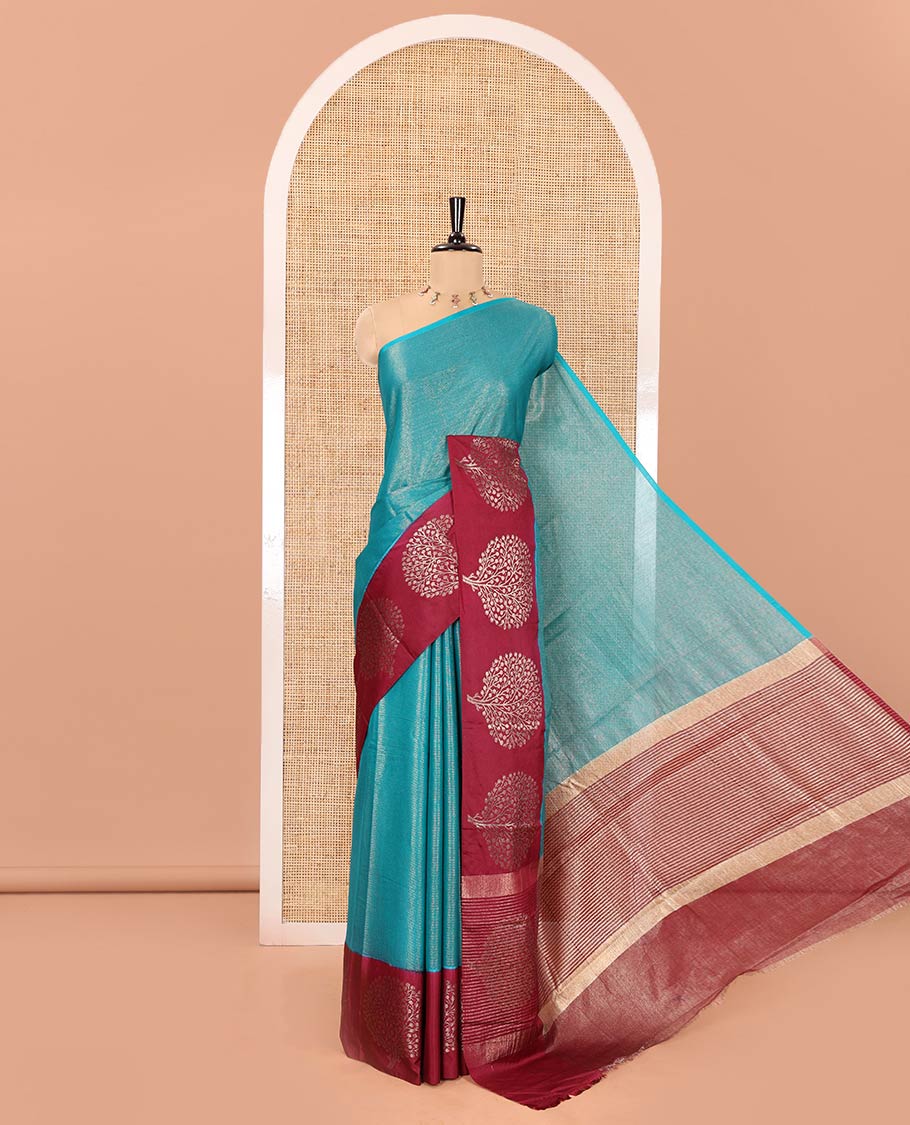 Rama Blue Tissue-Cotton Blended Saree, Subtly Sparkled with Vertical Stripes on Its Body, Complemented by Contrast Border of Tree Motifs Woven, a Pallu Steeped with Zari Stripes, and Paired with a Contrast Blouse