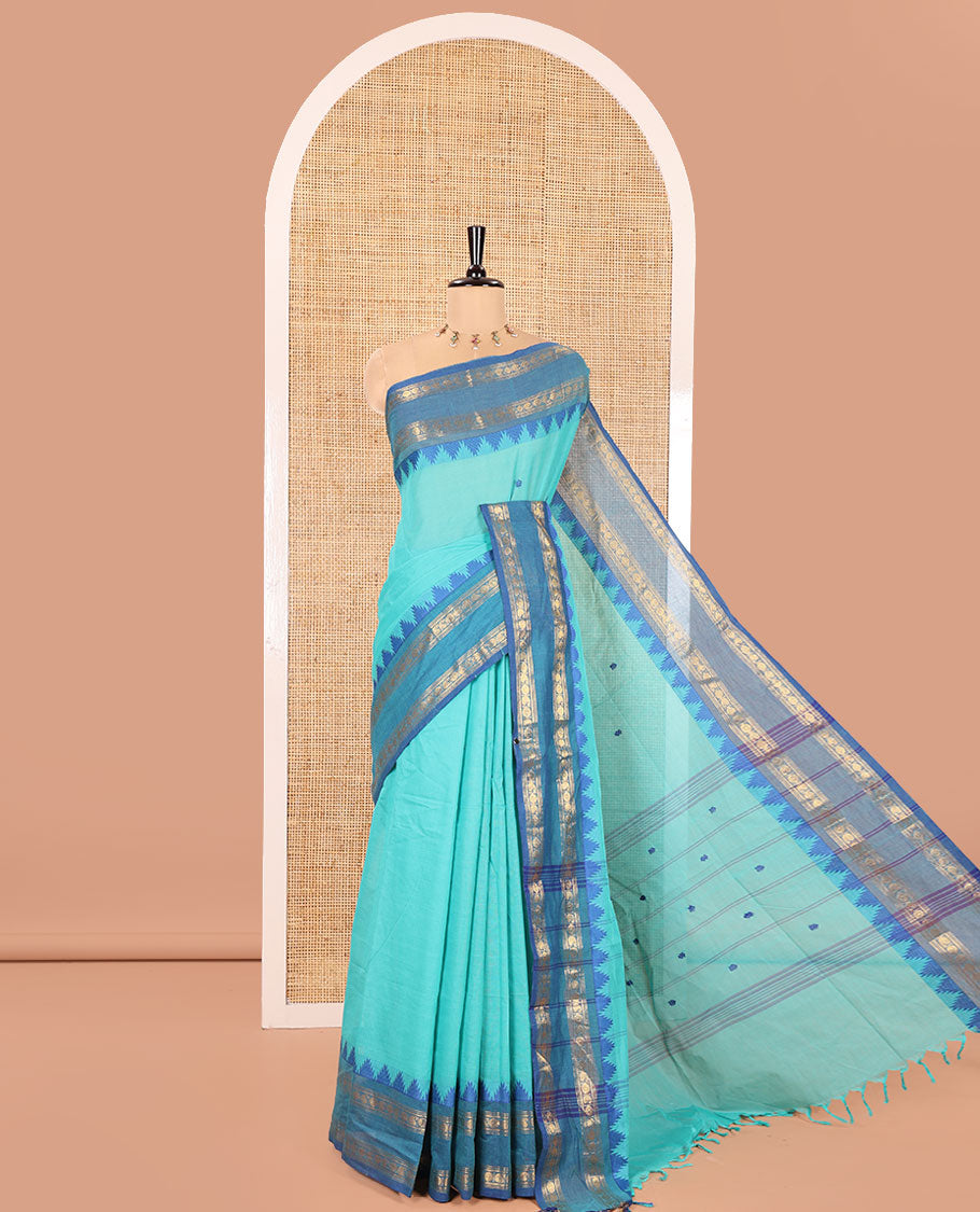 Rama Chettinad Cotton Saree, Subtly Decked up with Thread Buttas All Over Its Body, Complemented by a Contrast Temple Rettai Pettu Traditional Zari Design Border, Pallu of Stripes and Buttas, and Paired with a Matching Blouse
