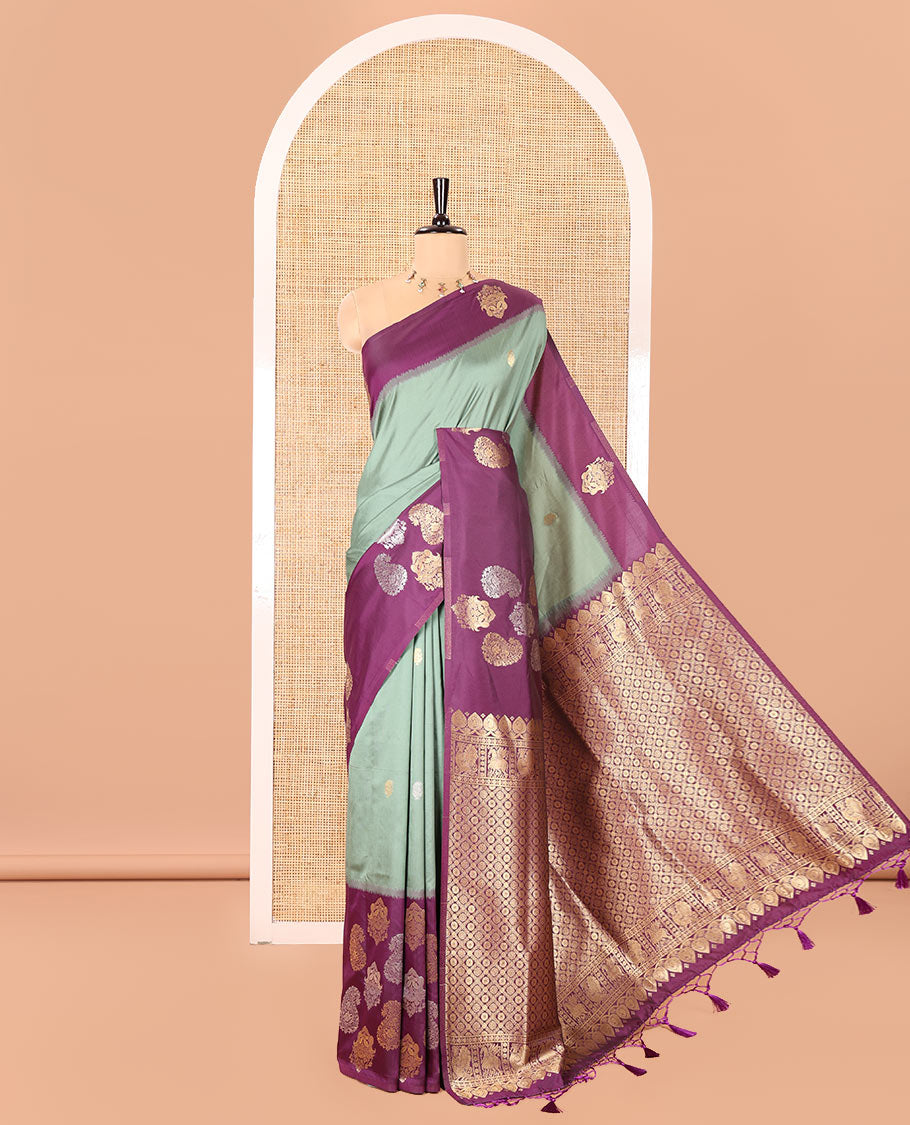 Green Elite Soft Silk Saree, Elevated with Zari Buttas All Over Its Body, Complemented by Contrast Border Steeped with Zari Buttas, Grand Jaal Design Pallu, and Paired with a Contrast Blouse
