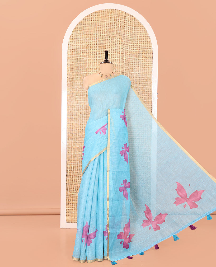 Blue Linen Cotton Saree, Mesmerized with Butterfly Buttas All Over Its Body, Subtle Piping Border, Pallu of Butterfly Print, and Paired with a Contrast Fairy Motifs Printed Blouse