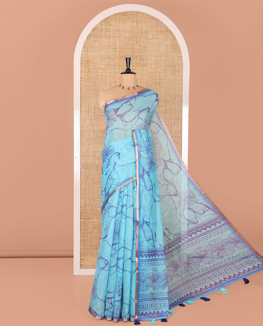 Blue Linen Cotton Saree, Adorned with Abstract Floral Print On Its Body, Subtle Piping Border, Pallu of Floral and Geometric Print, and Paired with a Contrast Blouse