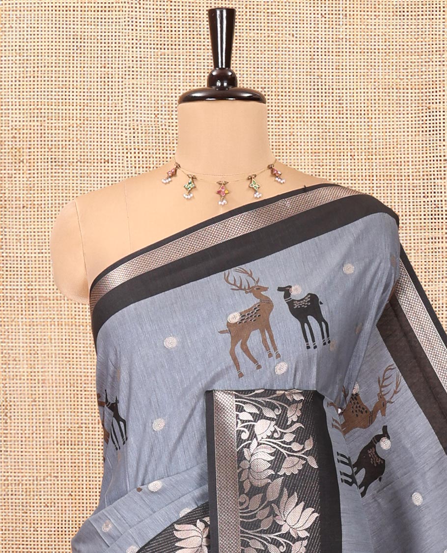 Grey Semi-Tussar Saree, Adorned with Round Buttas and Deer Buttas All Over Its Body, Highlighted by a Zari Border of Pichwai Lotus Design, Pallu of Lotus and Deer Motifs, and Paired with a Matching Blouse