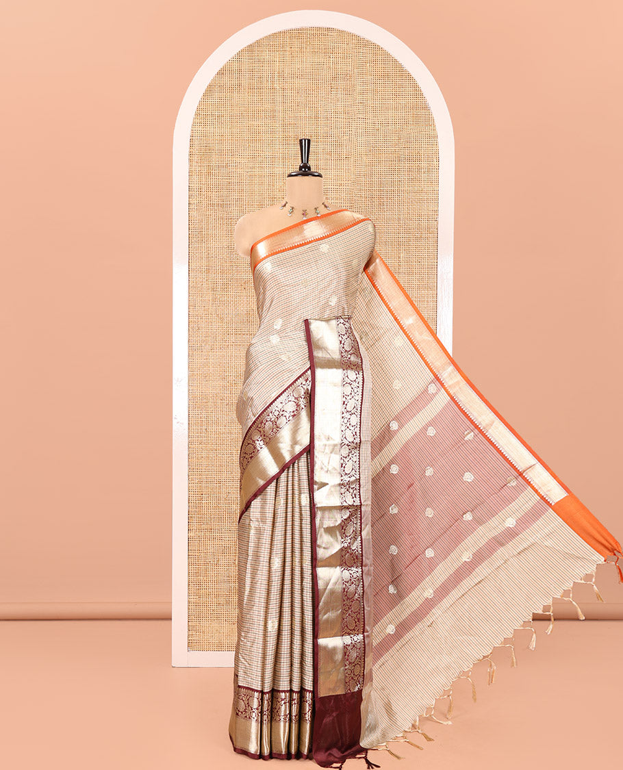 Chikku Soft Silk Saree, Subtly Woven with Vintage Checks On Its Body, Complemented by Contrast Traditional Zari Designs Woven Ganga Jamuna Border, Subtle Pallu and Paired with a Matching Blouse
