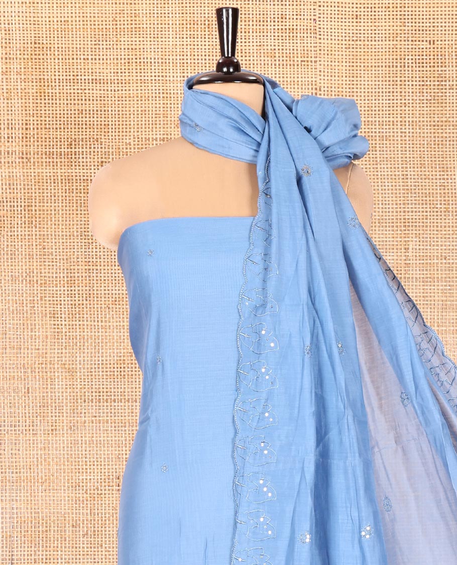 Blue Mul Chanderi Material Chudidar Set, Adorned with Appliqué Floral Embroidery on Its Top, a Plain Santoon Bottom, and Paired Scallop Embroidered Mul Chanderi Dupatta