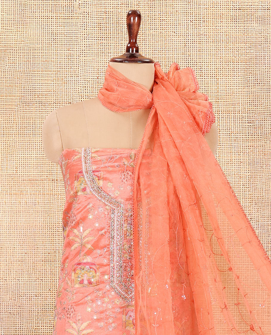Fanta Orange Organza Material Churidar, Intricately Printed Outlined Embroidery Top, a Matching Bottom, and a Floral Embroidered Dupatta