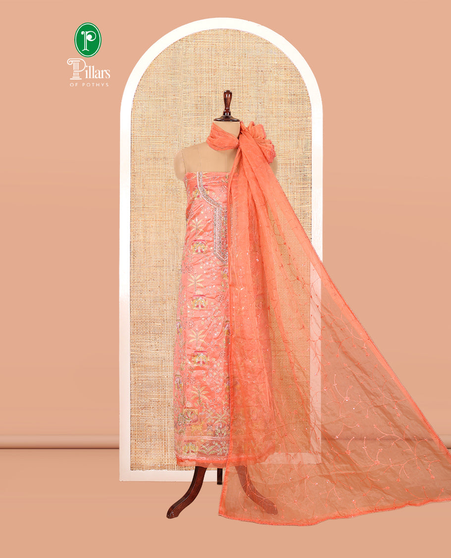 Fanta Orange Organza Material Churidar, Intricately Printed Outlined Embroidery Top, a Matching Bottom, and a Floral Embroidered Dupatta