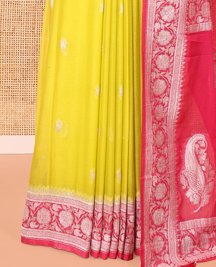 Green Banaras Fancy Georgette Saree, Decorated with Zari Buttas All Over Its Body, Complemented by a Contrast Floral Creeper Zari Border, Pallu Features Paisley Designs, and Paired with a Contrast Blouse