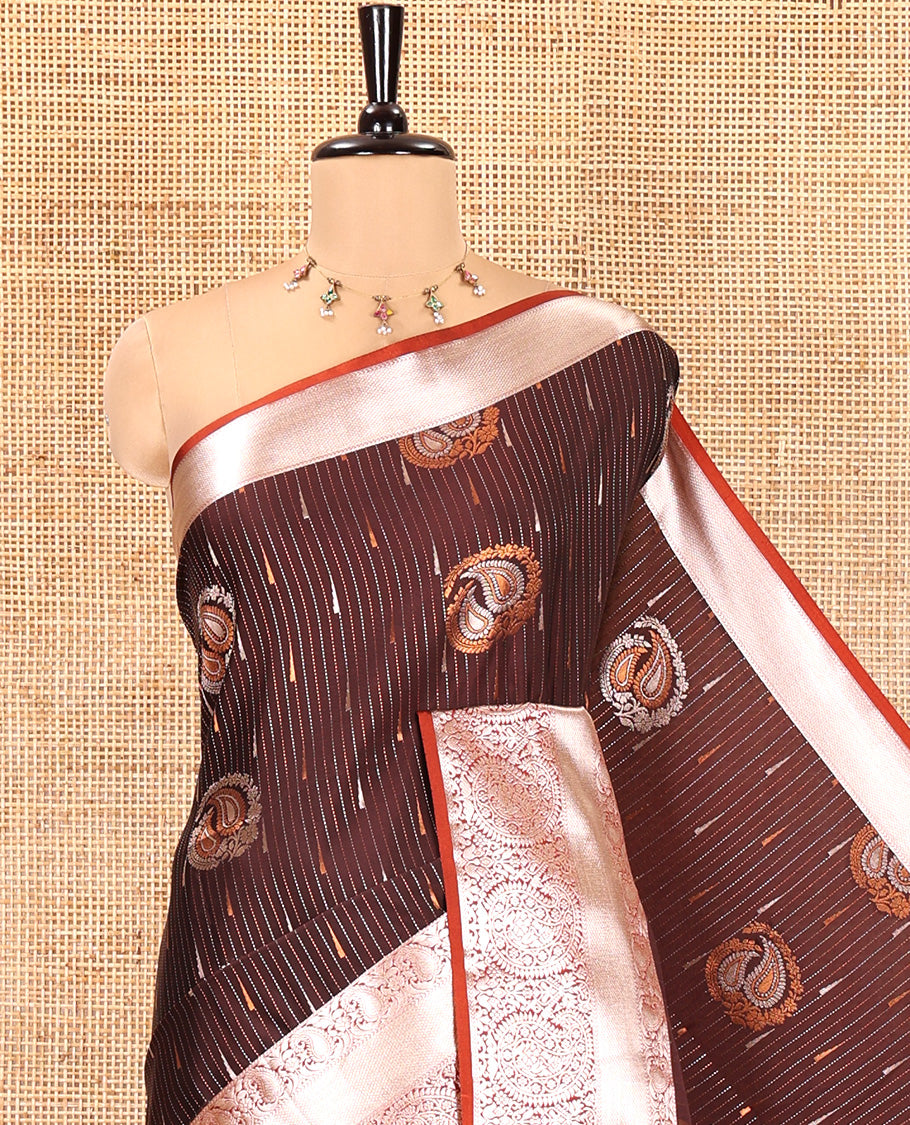 Coffee Brown Semi-Soft Silk Saree, Meticulously Crafted with Vaira Oosi, and Paisley Buttas All Over Its Body, Complemented by Contrast Traditional Border of Paisleys, Intricately Designed Pallu, and Paired with a Contrast Blouse