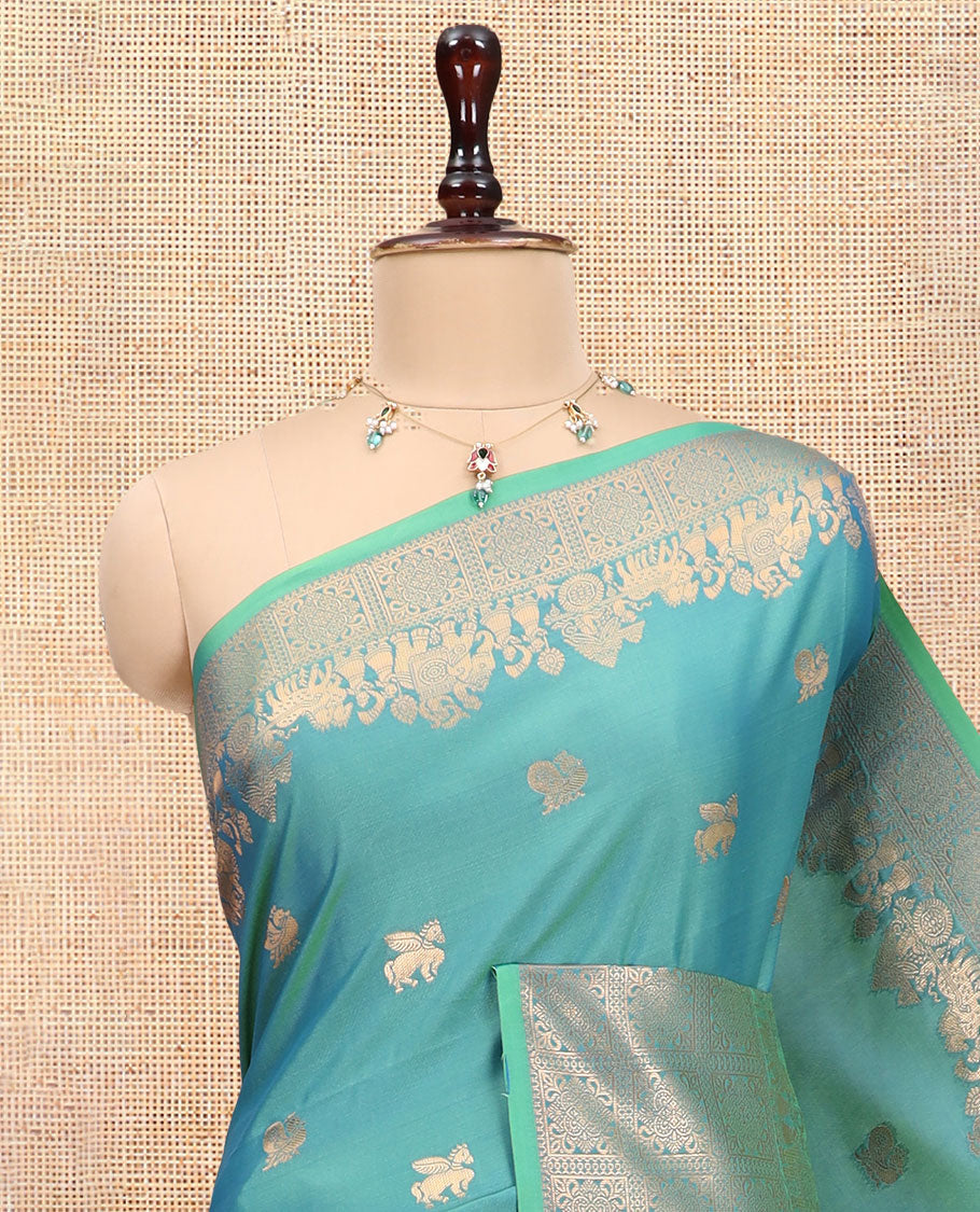 Peacock Blue Soft Silk Saree, Ornamented with Horse-Peacock Buttas, a Zari Border, Jaal Pallu, and a Matching Blouse