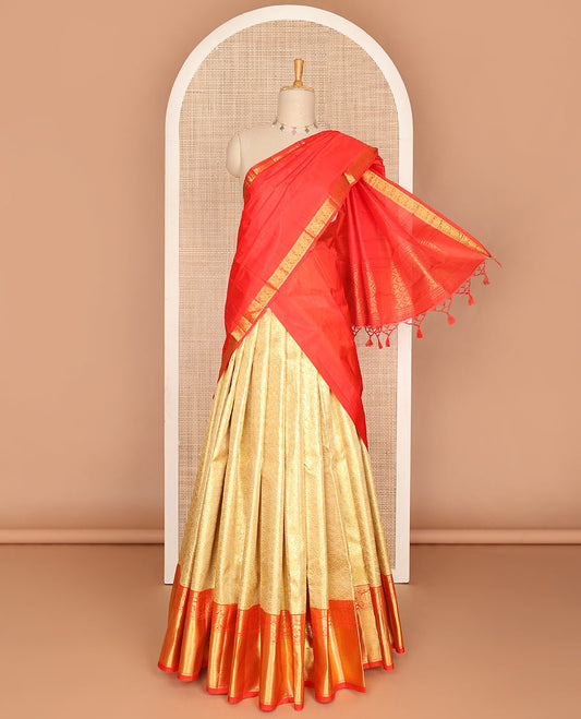 Gold pure-silk half saree, jacquard skirt, contrast border & blouse of rekku,muthu,neli & kodi visiry motifs & intricate dhavani