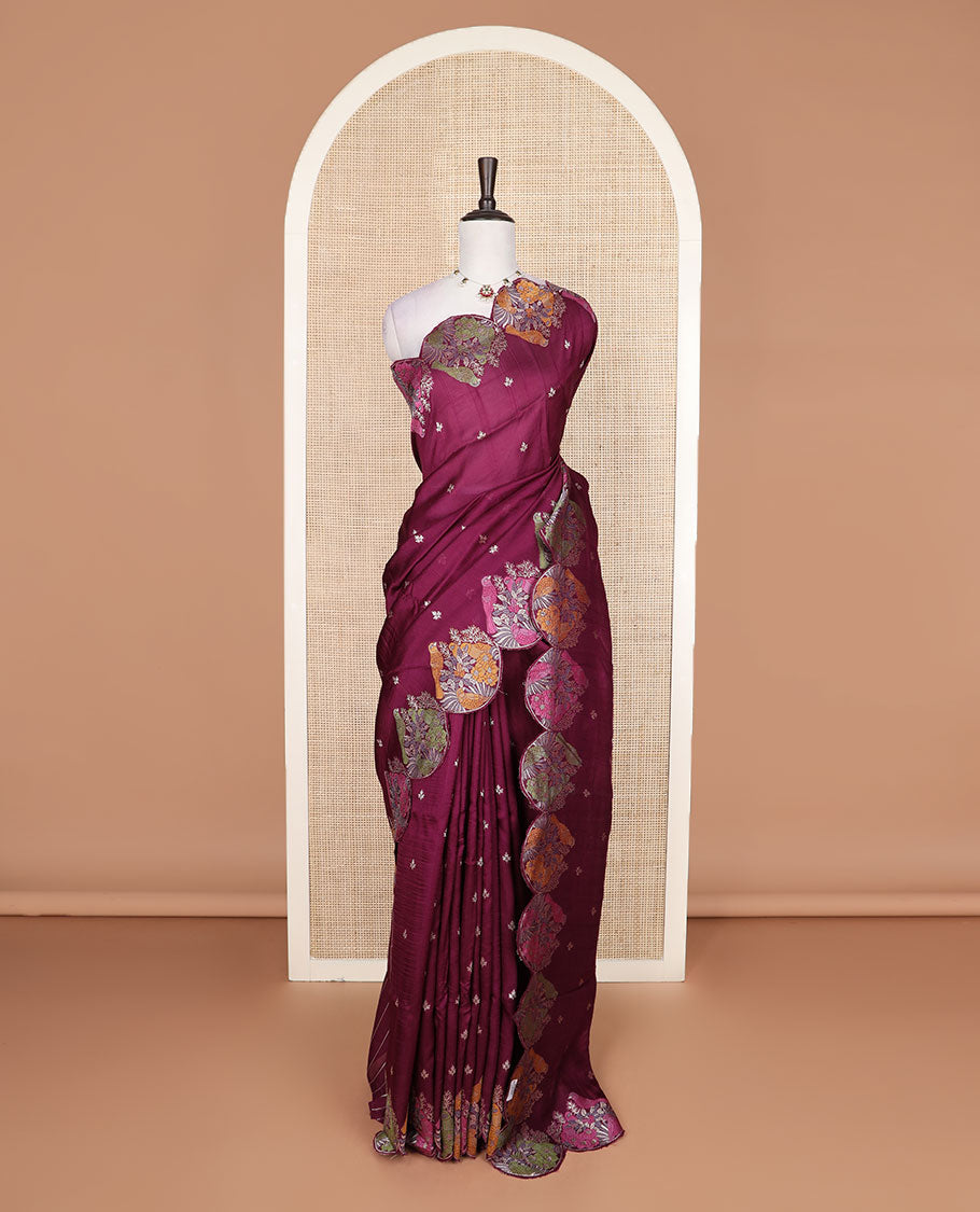 Wine Matka silk saree features rudraksham motifs, scallop floral motifs and bird embossed thread embroidery border