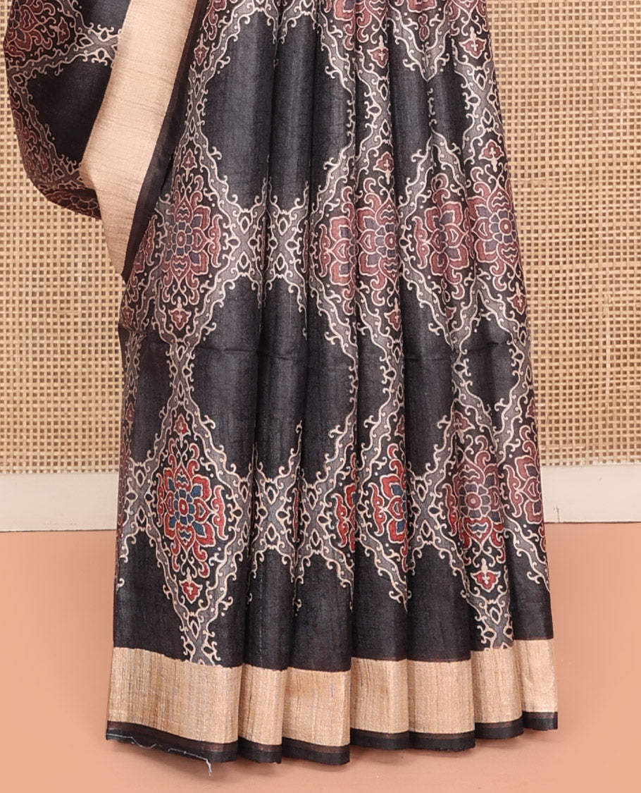Black Tussar Silk Saree, Artfully Detailed with Ajrakh-Style Jaal Design on Its Body, a Subtle Border, Ombre-Style Striped Pallu, and Paired with a Contrast Blouse