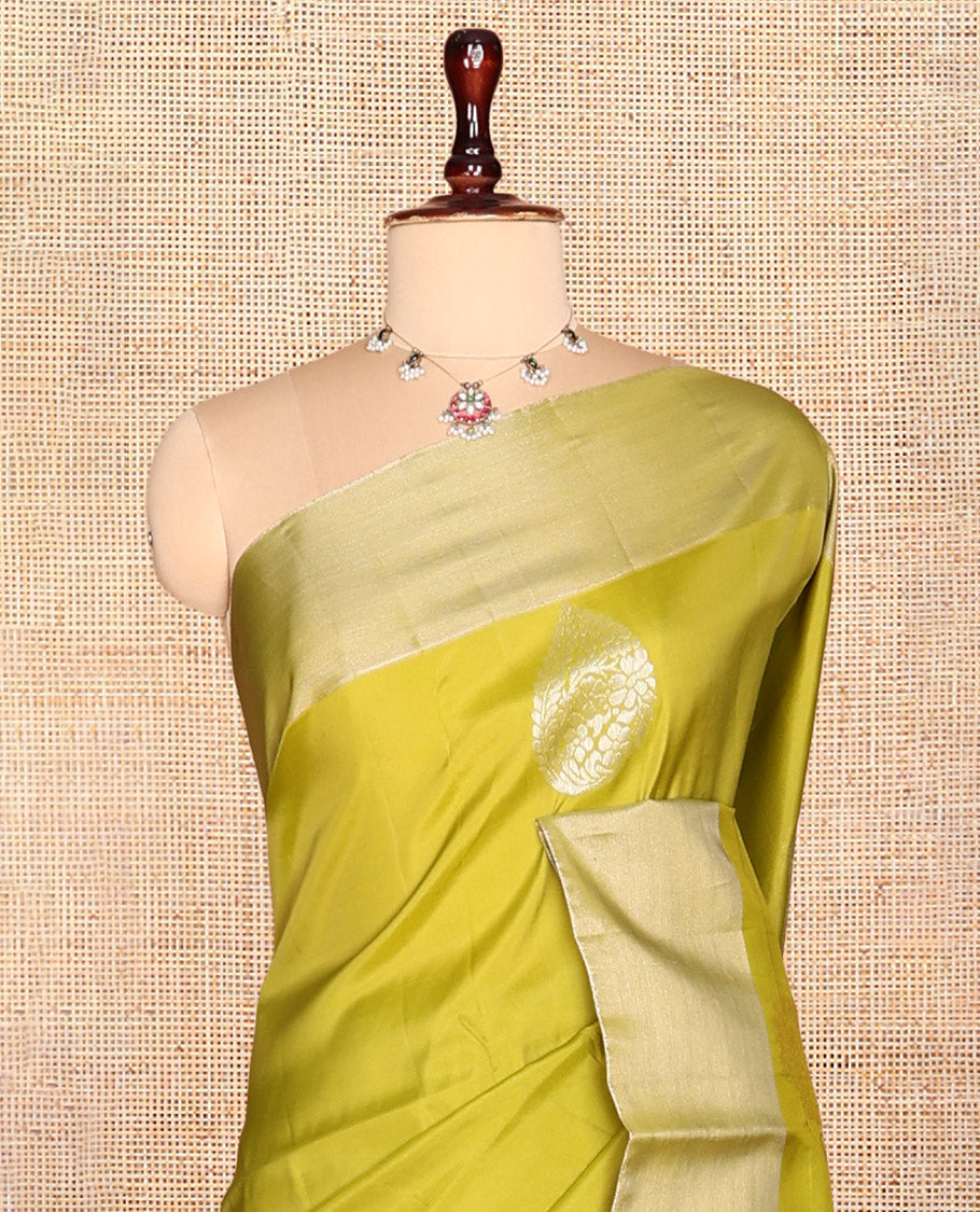 Green Semi Uppada Saree, Enriched with Zari Buttas, a Bavanji Border, Contrast Diagonal Leaf Vine Pallu, and a Contrast Blouse