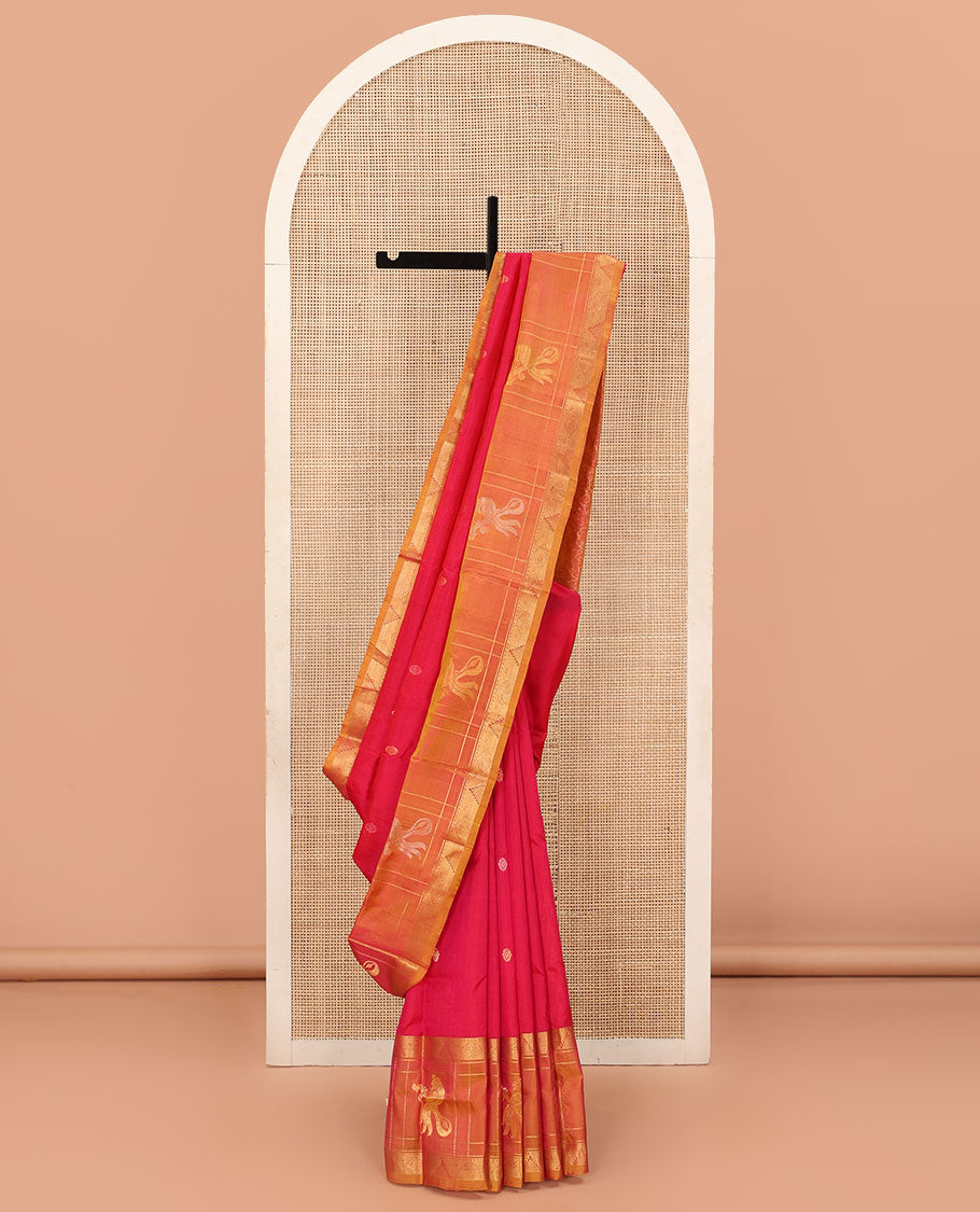 Red Uppada Silk Saree Elevated with Floral Buttas, Captivating Contrast Border of Traditional Zari Motifs and Peacock Motifs, Pallu Depicting Floral Jaal Design, and Paired with a Contrast Zari-Bordered Blouse