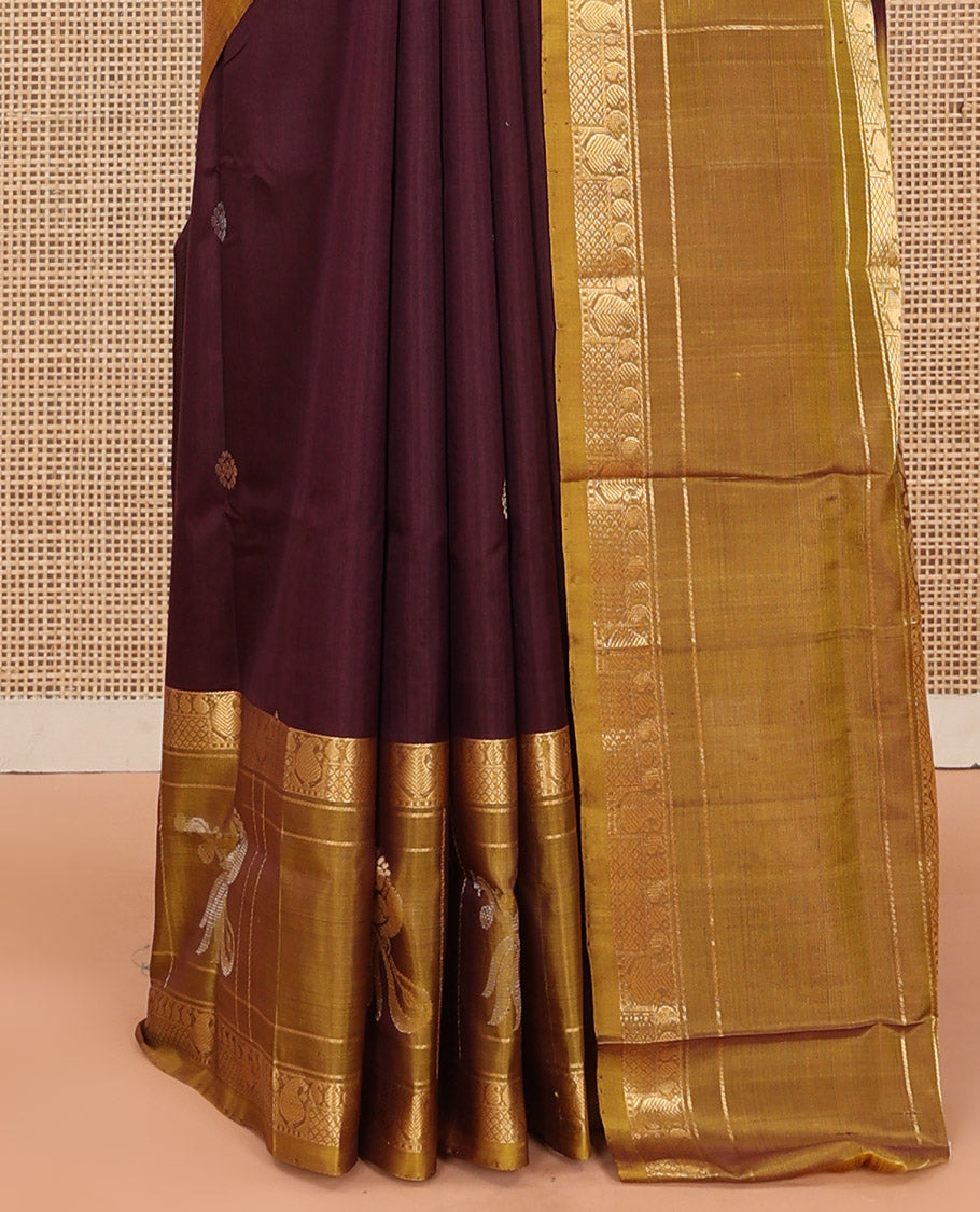 Maroon Uppada Silk Saree Elevated with Zari Buttas All Over Its Body, Complemented by Contrast Traditional Border of Peacock Veenai Designs, Sparsely Woven Pallu of Floral Designs, and Paired with a Contrast Blouse