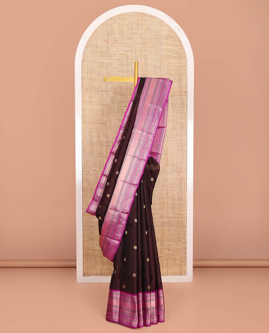 Brown Vasundhara Lite-Silk Mix Saree, Enriched with Zari Buttas on Its Body, Complemented by a Contrast Border of Thilakam Mokku, Mayil, Yaanai, and Mayil Kann Designs, Gleaming Zari Pallu of Jaal Designs, and Paired with a Contrast Blouse