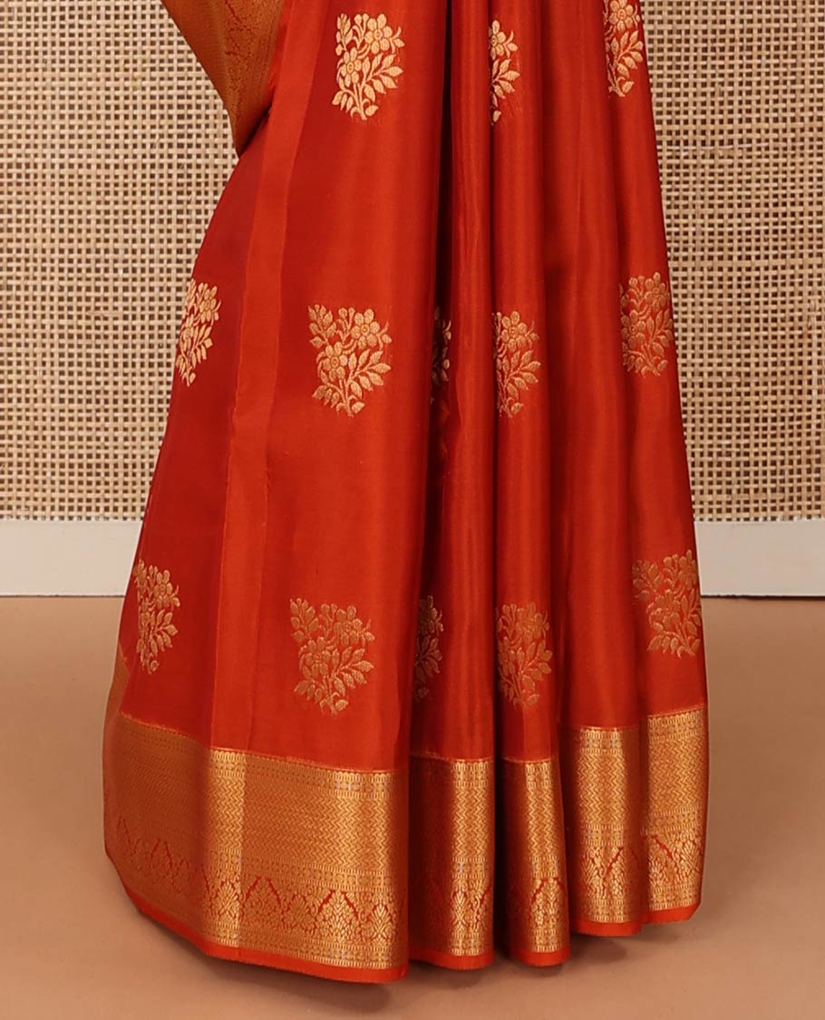 Orange zari buttas Vasundhara silk mix saree, contrast border of rekku, muthu, poun, vanki, and zari designs, and leaf vine design pallu