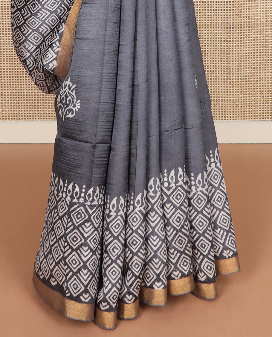 Grey printed banana pith saree, self-border of print, and zari work, and printed pallu