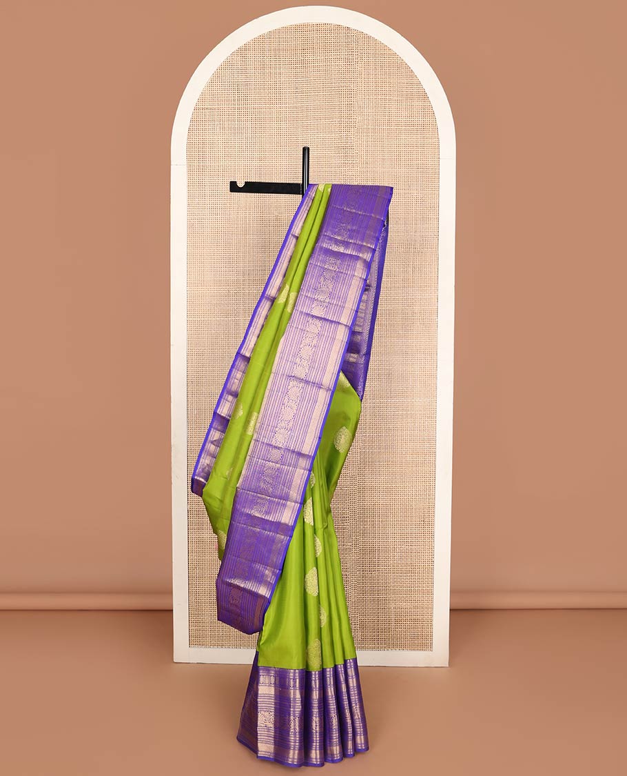 Green buttas silk saree with contrast thilakam mokku, banaras, kodi visiry, mayil kann design & zari design pallu