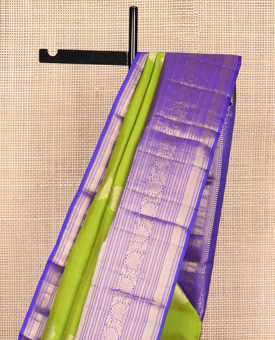 Green buttas silk saree with contrast thilakam mokku, banaras, kodi visiry, mayil kann design & zari design pallu