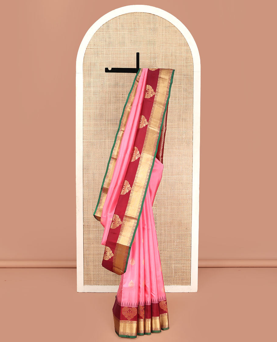 Pink Vasundhara Silk Saree, Finely Designed with Zari Buttas All Over Its Body, Complemented by Contrast Temple Border of Mayil, Rudraksham, and Mayil Kann Designs, Grand Jaal Pallu, and Paired with a Contrast Blouse