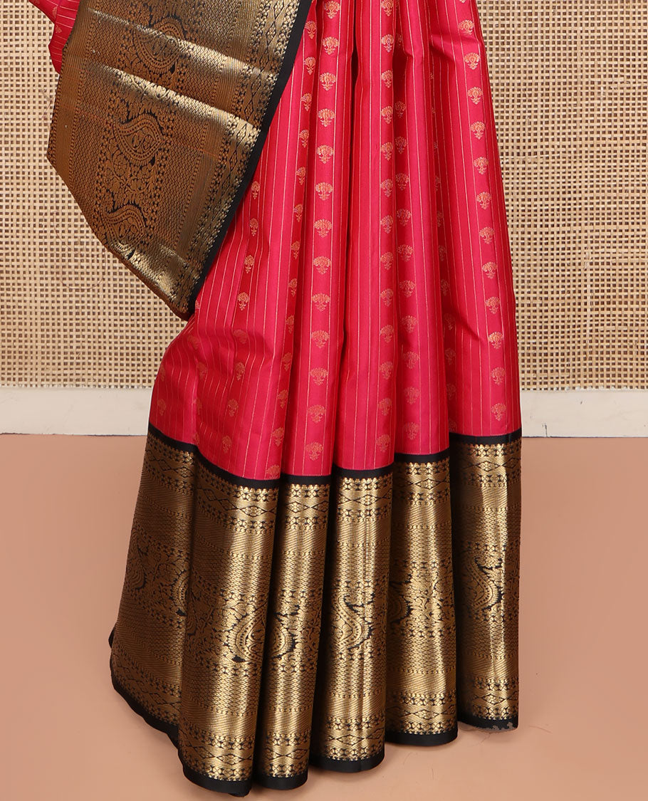 Red Vasundhara Silk Saree, Subtly Sparkled with Buttas and Stripes All Over Its Body, Complemented by Contrast Zari Border of Diamond, Mayil Kann, Manga, and Kodi Visiry Designs, Opulently Embellished Pallu, and Paired with a Contrast Blouse