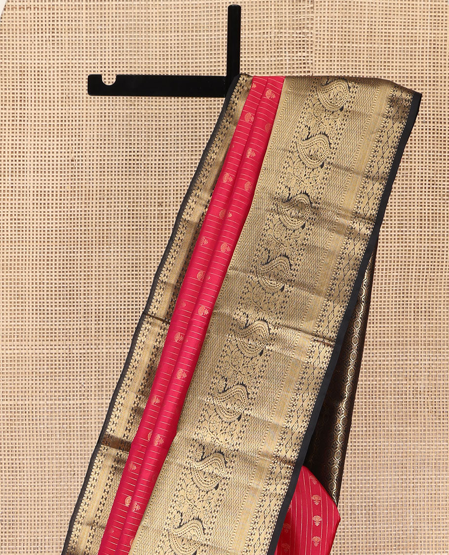 Red Vasundhara Silk Saree, Subtly Sparkled with Buttas and Stripes All Over Its Body, Complemented by Contrast Zari Border of Diamond, Mayil Kann, Manga, and Kodi Visiry Designs, Opulently Embellished Pallu, and Paired with a Contrast Blouse