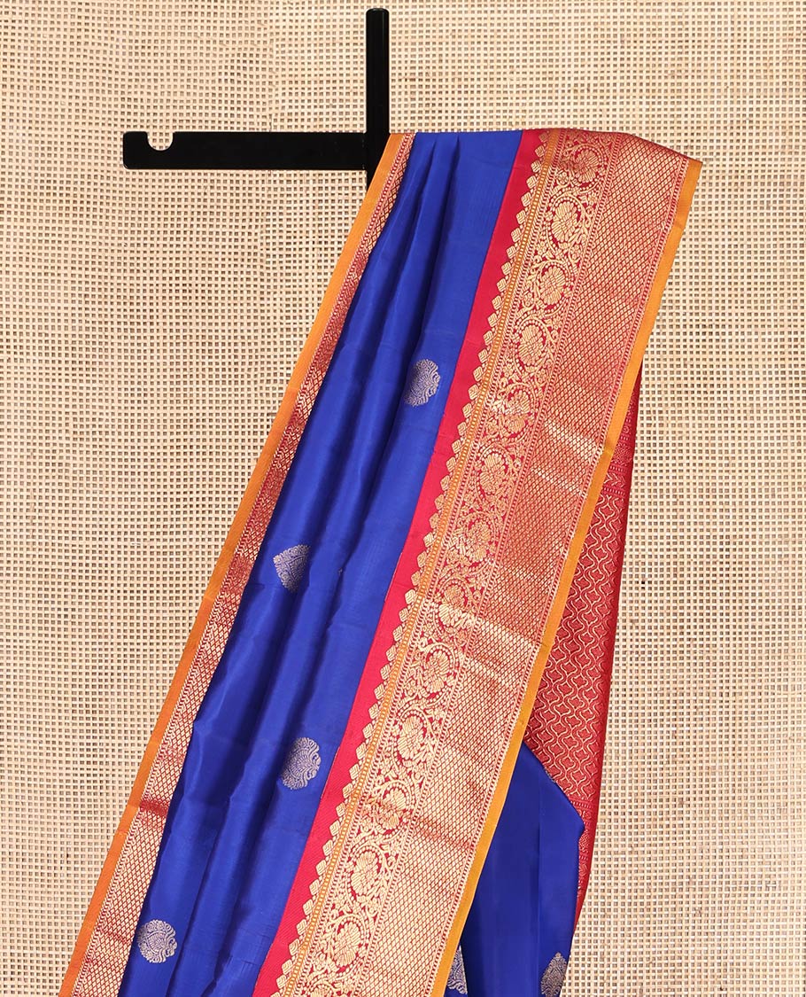 Royal Blue Vasundhara Silk Saree, Decorated with Zari Buttas, a Contrast Border of Thilakam Mokku, Muthu, Banaras, Kodi Visiry, and Mayil Kann Designs, Grand Pallu, and a Contrast Blouse