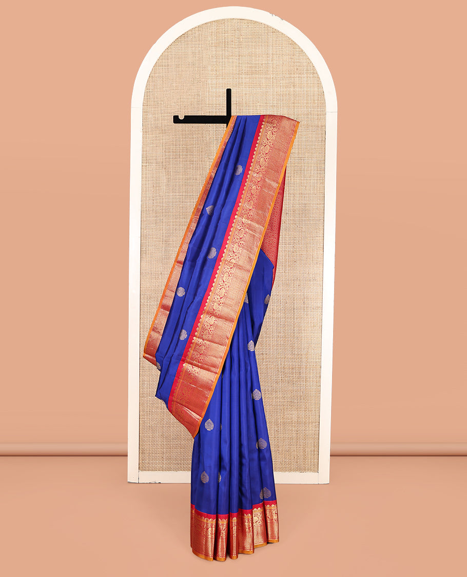 Royal Blue Vasundhara Silk Saree, Decorated with Zari Buttas, a Contrast Border of Thilakam Mokku, Muthu, Banaras, Kodi Visiry, and Mayil Kann Designs, Grand Pallu, and a Contrast Blouse