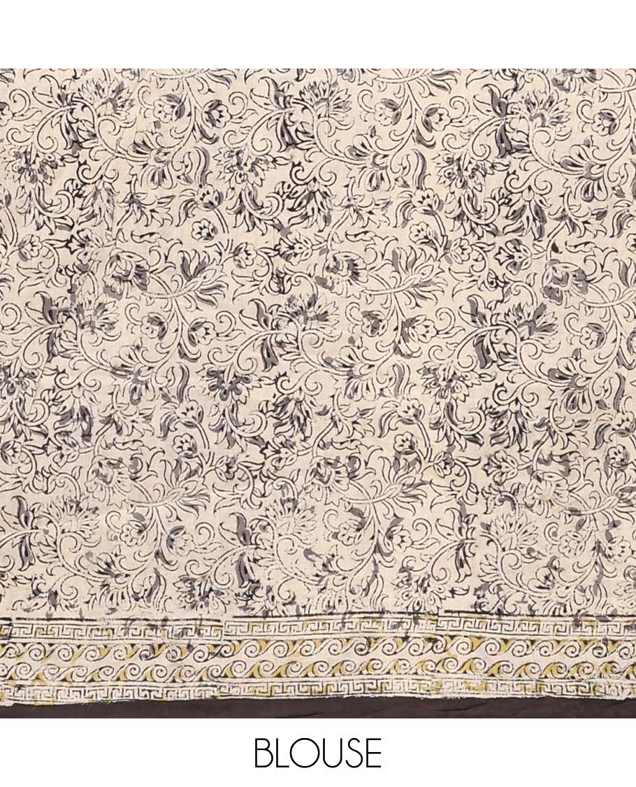 Black floral vine machine-printed Kalamkari cotton saree, geometric printed border, and pallu of floral-geometric print