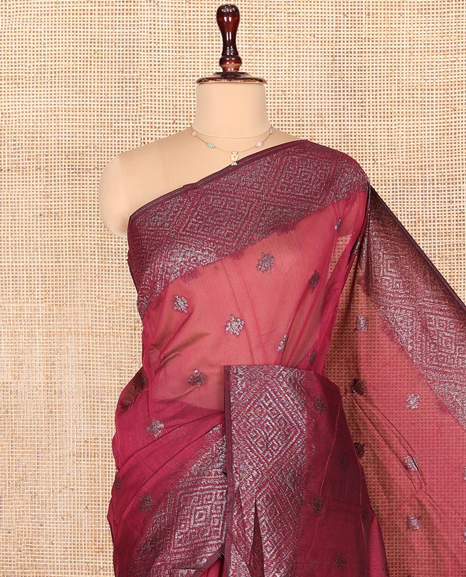 Red Semi-Silk Cotton Saree, Gleamed up with Zari Buttas on Its Body, Highlighted by Zari Border, Pallu of Jaal Designs, and Paired with a Matching Blouse