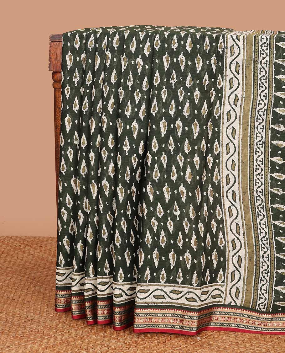 Green pine tree style motifs printed mul mul cotton saree, contrast traditional motifs border, and pallu of floral and pine tree motifs print
