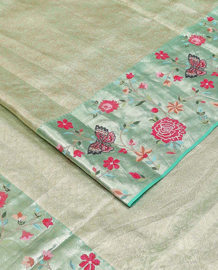 Pista green jacquard Kanchipuram silk saree, contrast traditional zari with meenakari floral vine, and butterflies embroidered border, and jaal pallu