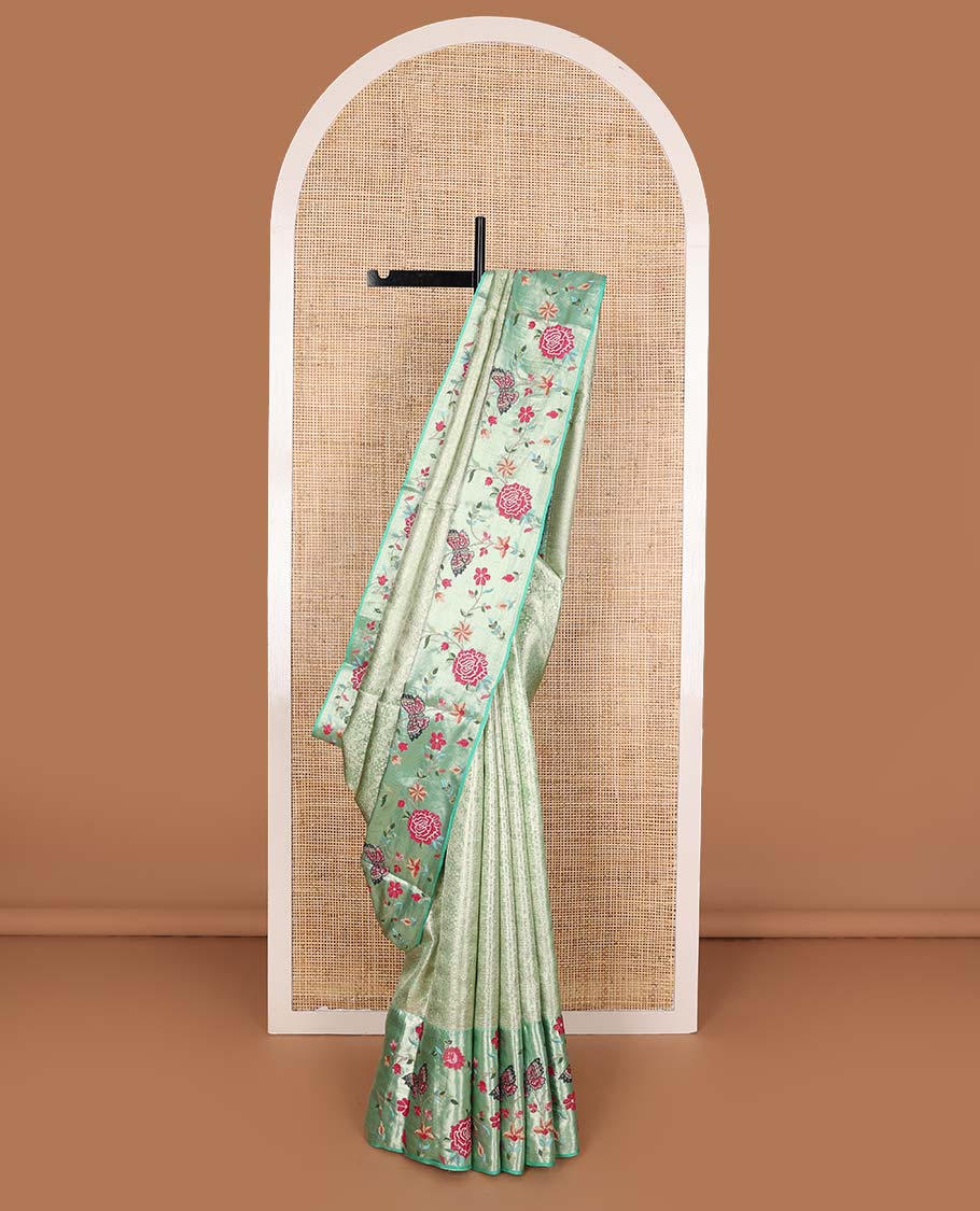 Pista green jacquard Kanchipuram silk saree, contrast traditional zari with meenakari floral vine, and butterflies embroidered border, and jaal pallu