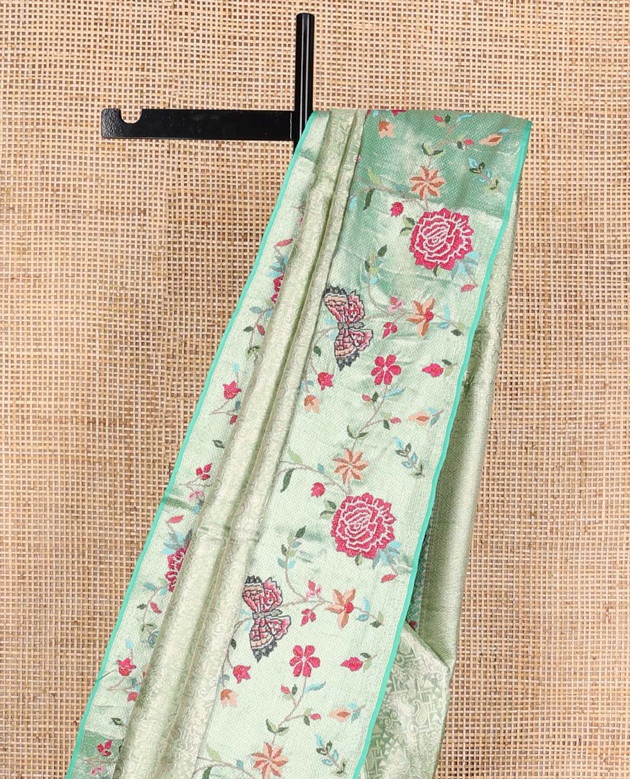 Pista green jacquard Kanchipuram silk saree, contrast traditional zari with meenakari floral vine, and butterflies embroidered border, and jaal pallu